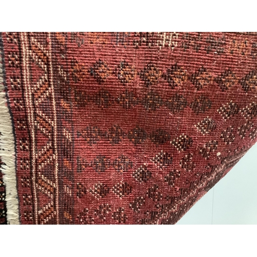 34 - A Hamadan red ground rug, 150 x 108cm together with a North West Persian style rug and an Afghan run... 