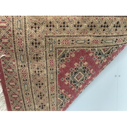 34 - A Hamadan red ground rug, 150 x 108cm together with a North West Persian style rug and an Afghan run... 