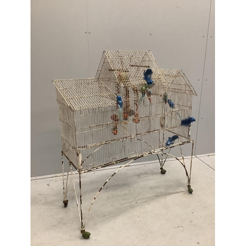 35 - A vintage painted wirework bird cage on stand, width 98cm, depth 36cm, height 117cm. Condition - poo... 