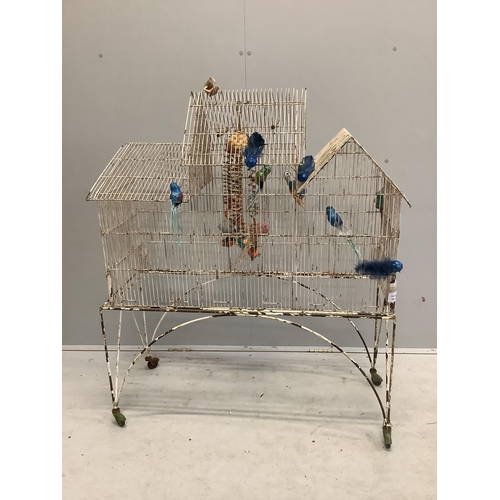 35 - A vintage painted wirework bird cage on stand, width 98cm, depth 36cm, height 117cm. Condition - poo... 