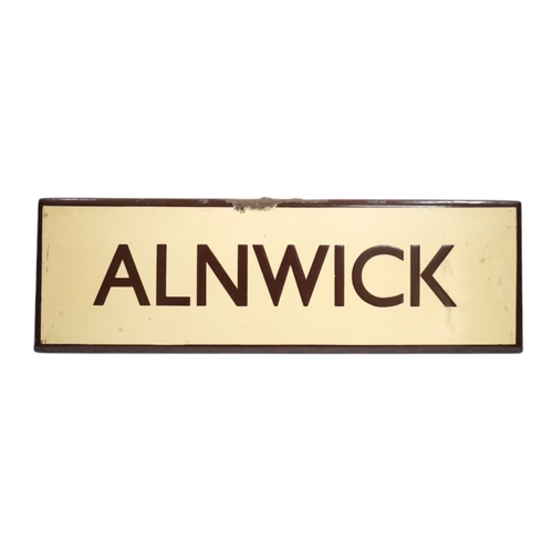 361 - A London & North Eastern Railway enamel lamp tablet for Alnwick. Condition - fair to good.