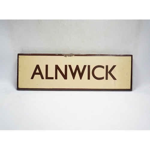 361 - A London & North Eastern Railway enamel lamp tablet for Alnwick. Condition - fair to good.