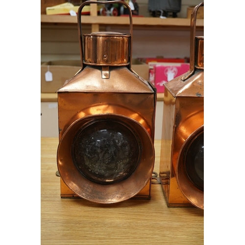 367 - A pair of copper marine or railway oil lamps (missing burners and reservoirs), 44cm high. Condition ... 