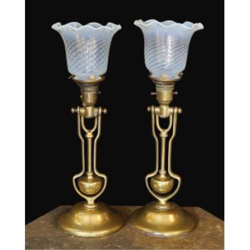 372 - A pair of brass Pullman lamps with gimbal stems and Vaseline glass shades, modelled for wall mountin... 