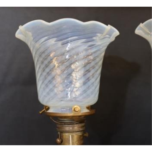 372 - A pair of brass Pullman lamps with gimbal stems and Vaseline glass shades, modelled for wall mountin... 