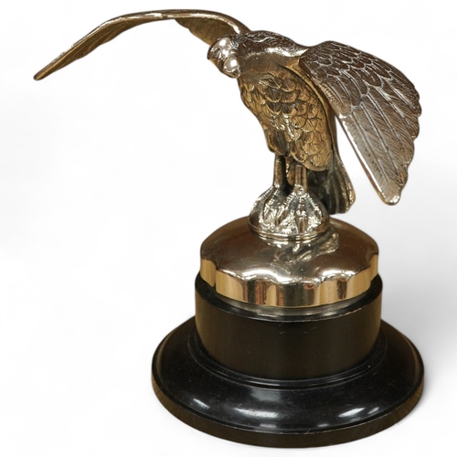 376 - A large chromed eagle car mascot, mounted on a large radiator cap and turned socle, height 21.5cm. C... 