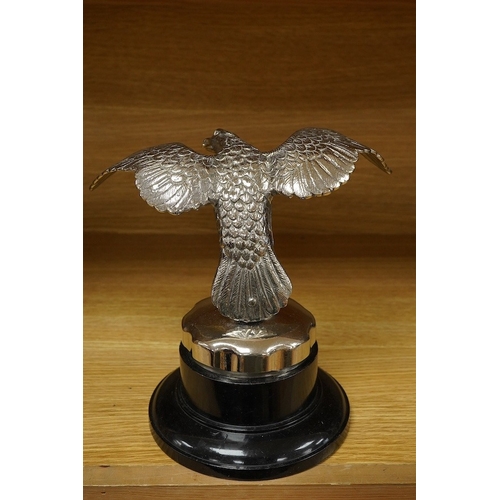 376 - A large chromed eagle car mascot, mounted on a large radiator cap and turned socle, height 21.5cm. C... 