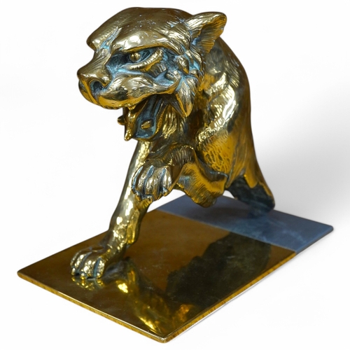 382 - A substantial brass car mascot of the front half of a big cat roaring, mounted on a sheet of brass, ... 