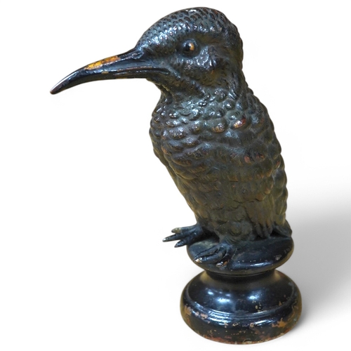 384 - A cold painted bronze car mascot in the form of a kingfisher mounted on a circular socle, 12.5cm hig... 