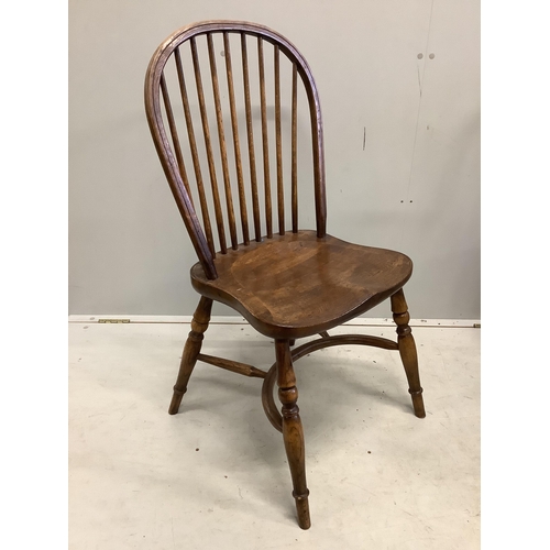 39 - A set of six oak Windsor comb back dining chairs with crinoline stretchers, width 48cm, depth  43cm,... 