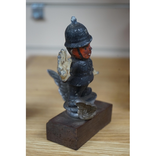 390 - A cold painted cast aluminium car mascot in the form of a caricature of a policeman on associated ch... 