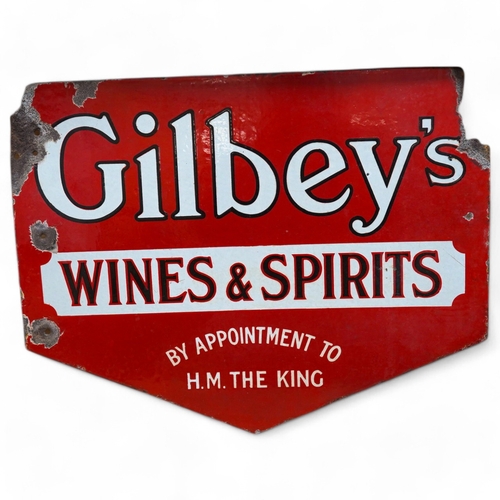 402 - A 1930's double sided Gilbey's Wines & Spirits enamel sign, 41.5cm high. Condition - as per online i... 