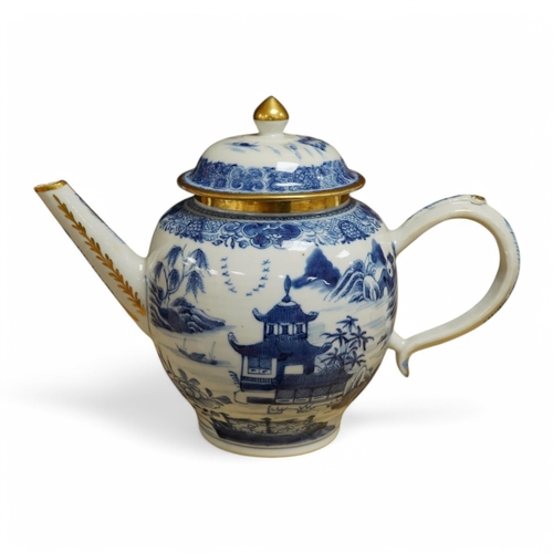 412 - A Chinese export blue and white teapot, c.1790, painted with pagodas, 24cm wide. Condition - some ch... 