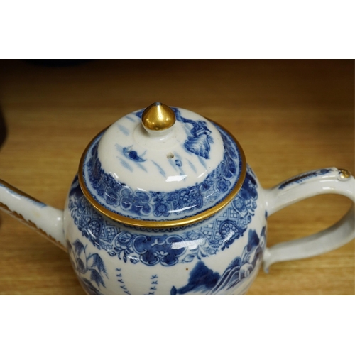 412 - A Chinese export blue and white teapot, c.1790, painted with pagodas, 24cm wide. Condition - some ch... 