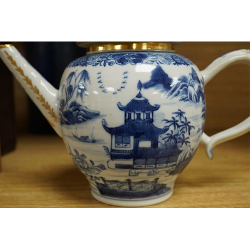 412 - A Chinese export blue and white teapot, c.1790, painted with pagodas, 24cm wide. Condition - some ch... 