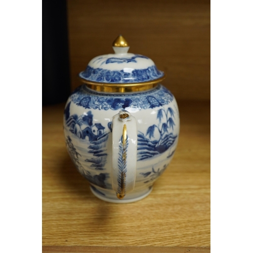 412 - A Chinese export blue and white teapot, c.1790, painted with pagodas, 24cm wide. Condition - some ch... 