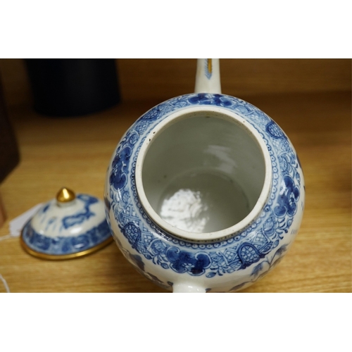 412 - A Chinese export blue and white teapot, c.1790, painted with pagodas, 24cm wide. Condition - some ch... 