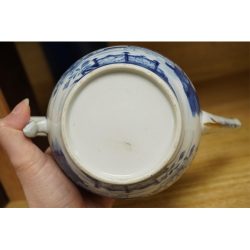 412 - A Chinese export blue and white teapot, c.1790, painted with pagodas, 24cm wide. Condition - some ch... 