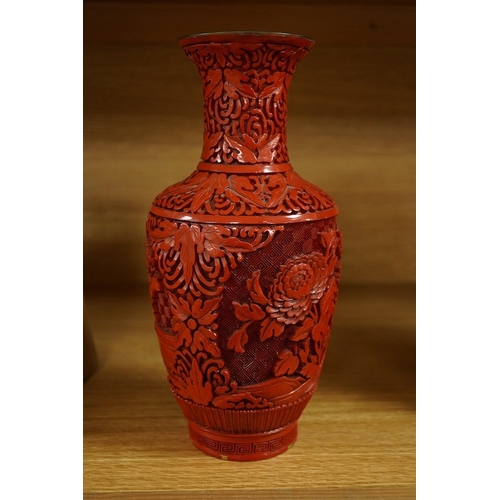 416 - A Chinese red lacquered vase, 25.5cm. Condition - good