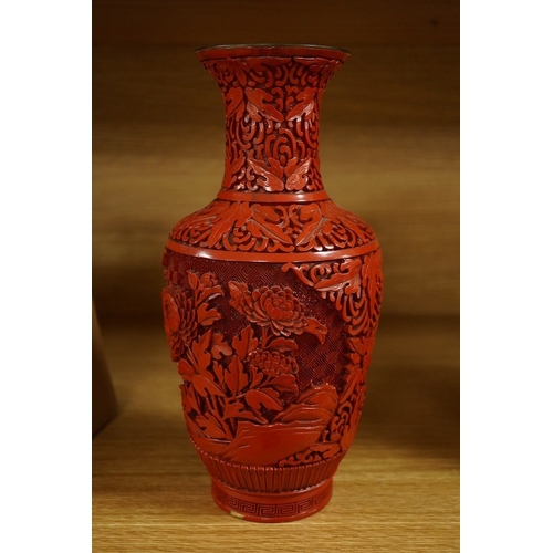 416 - A Chinese red lacquered vase, 25.5cm. Condition - good