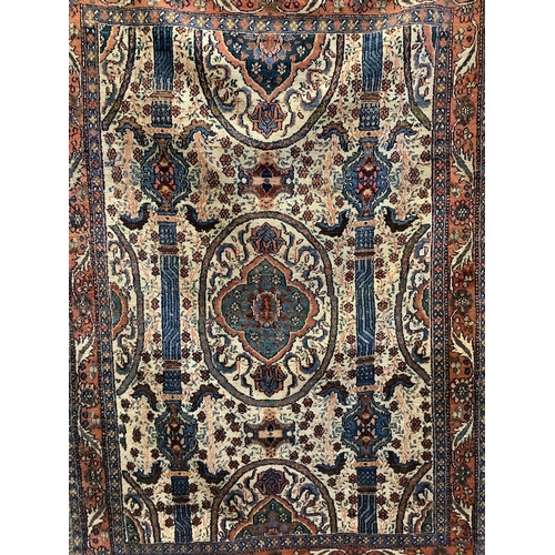 42 - A North West Persian ivory ground rug, 200 x 142cm. Condition - fair