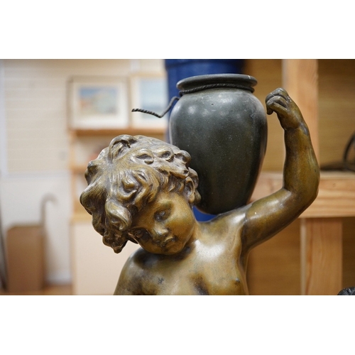 424 - After Auguste Moreau, a 19th century French bronzed spelter figure of an amorini carrying a water pi... 