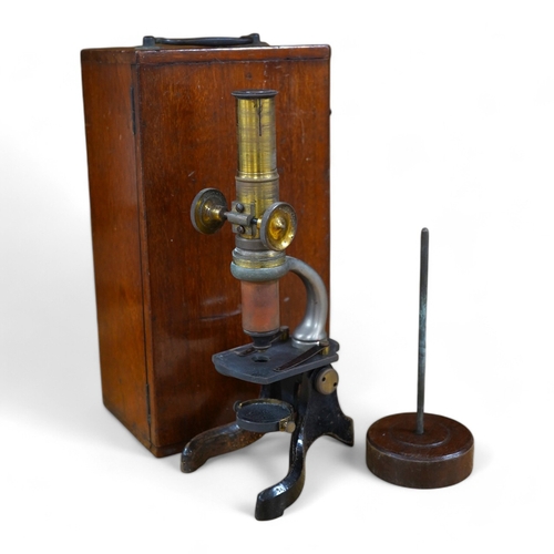 432 - A small mahogany cased microscope, microscope 24cm high. Condition - case good microscope well used... 