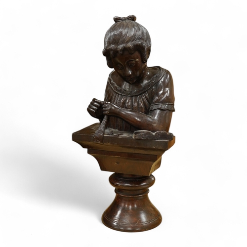 442 - A carved wood bust of a girl sewing, 47cm high. Condition - two old cracks to the back of carving... 