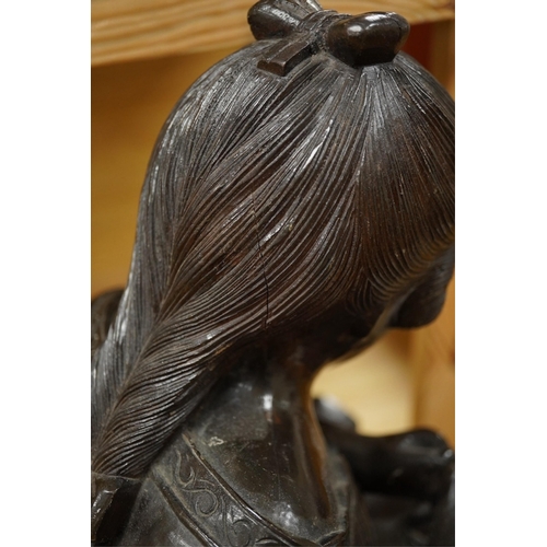 442 - A carved wood bust of a girl sewing, 47cm high. Condition - two old cracks to the back of carving... 