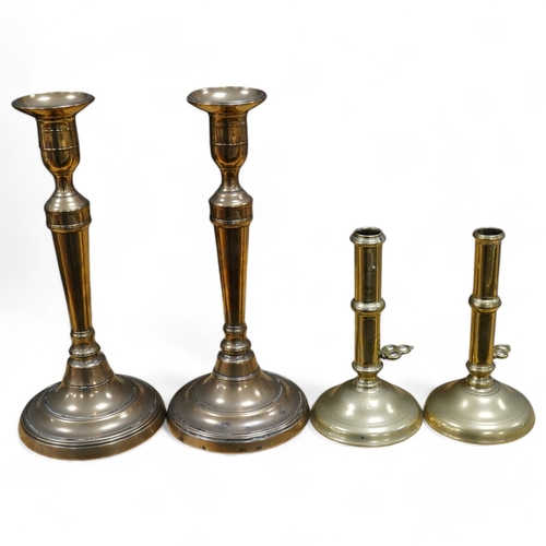 443 - Two pairs of candlesticks to include 18th century brass ejector examples, 37cm wide. Condition - goo... 