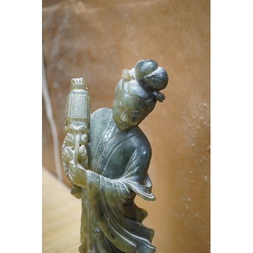 446 - A Chinese carved green soapstone figure of Guanyin, 34cm high. Condition - fair to good