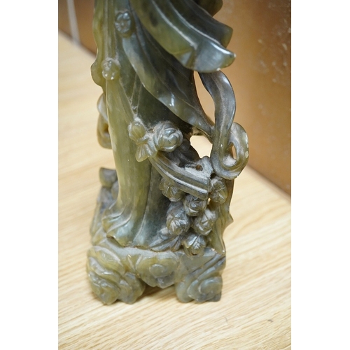 446 - A Chinese carved green soapstone figure of Guanyin, 34cm high. Condition - fair to good