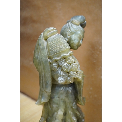 446 - A Chinese carved green soapstone figure of Guanyin, 34cm high. Condition - fair to good