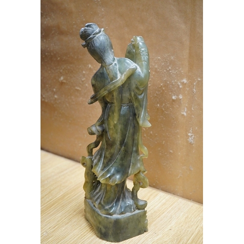 446 - A Chinese carved green soapstone figure of Guanyin, 34cm high. Condition - fair to good