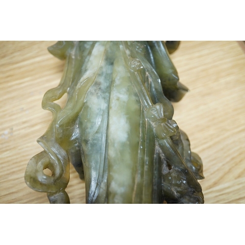 446 - A Chinese carved green soapstone figure of Guanyin, 34cm high. Condition - fair to good