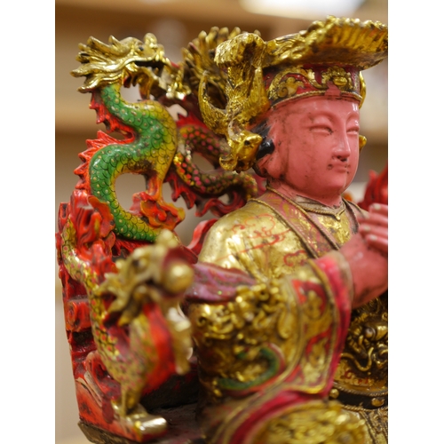 457 - A Chinese gilt and painted composition figure of a seated immortal, 31cm tall. Condition - poor to f... 