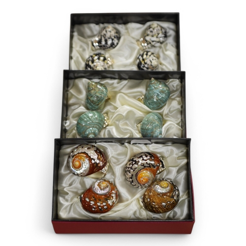 462 - Hans Turnwald, three boxed sets of modernist shell and plated napkin rings in the form of snails. Co... 