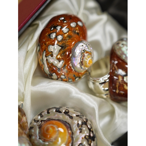 462 - Hans Turnwald, three boxed sets of modernist shell and plated napkin rings in the form of snails. Co... 