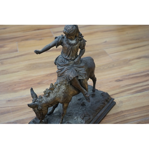 464 - A silvered resin figure of a girl on a donkey, 45cm high. Condition - poor