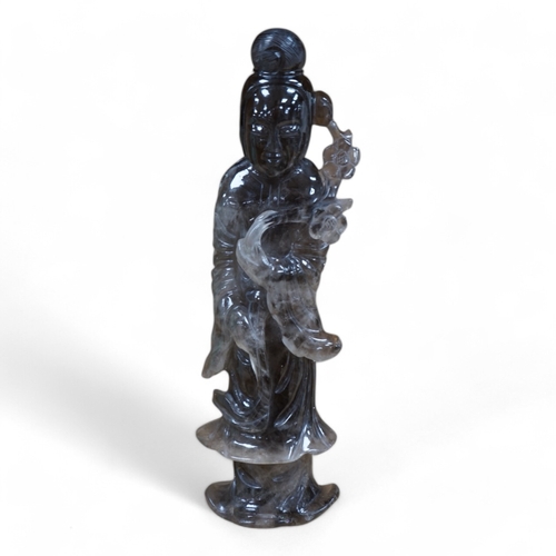 471 - A Chinese smoky quartz figure of Guanyin, 23cm. Condition - fair to good