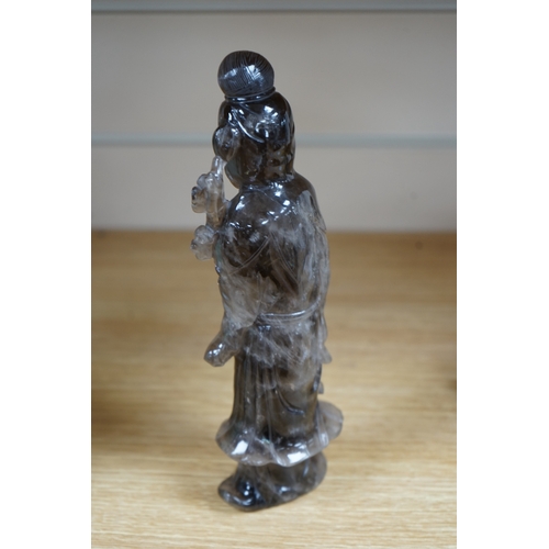 471 - A Chinese smoky quartz figure of Guanyin, 23cm. Condition - fair to good