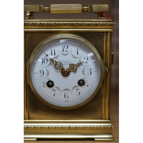 474 - A late 19th century French brass large carriage clock with convex enamel dial, retailed by Robinson ... 