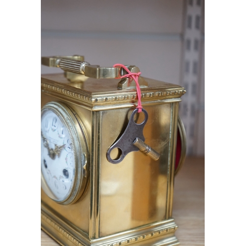 474 - A late 19th century French brass large carriage clock with convex enamel dial, retailed by Robinson ... 