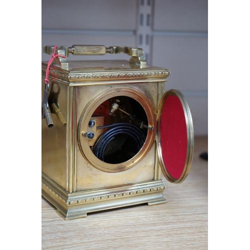 474 - A late 19th century French brass large carriage clock with convex enamel dial, retailed by Robinson ... 