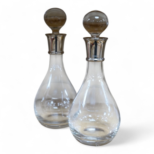 475 - A pair of modern silver collared glass decanters and stoppers, 31cm. Condition - fair to good