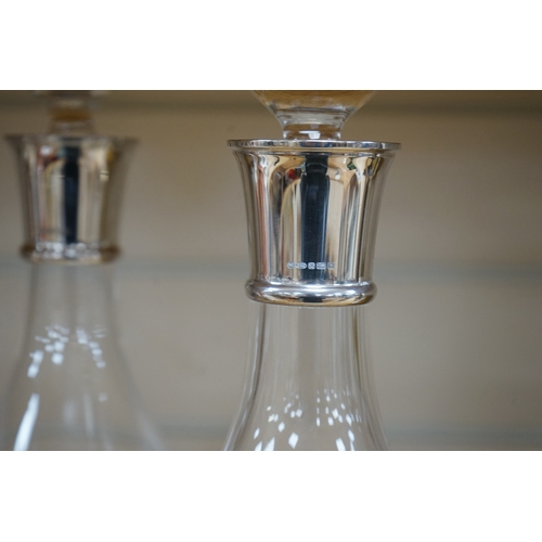 475 - A pair of modern silver collared glass decanters and stoppers, 31cm. Condition - fair to good