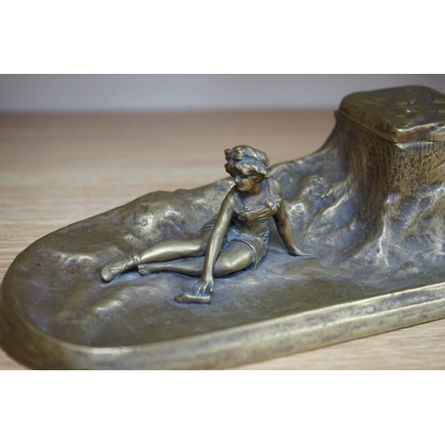 485 - An Art Nouveau bronze bathing lady inkwell, 26cm wide. Condition - good