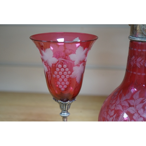 488 - A Victorian electroplate mounted cranberry glass claret jug and a similar goblet by Elkington & Co. ... 