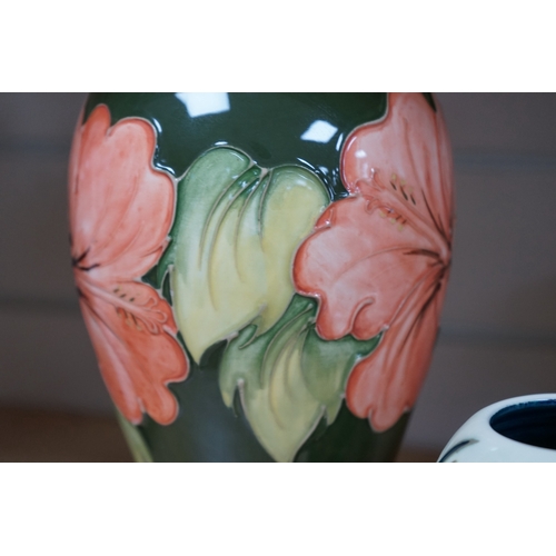 491 - Three 1990's Moorcroft vases, Hibiscus and Lamia pattern, tallest 26cm. Condition - good