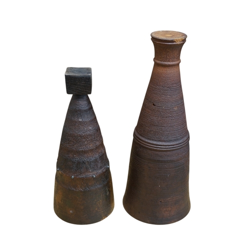 497 - Two Mike Chai xanthorea vases, 45.5cm. Condition - fair